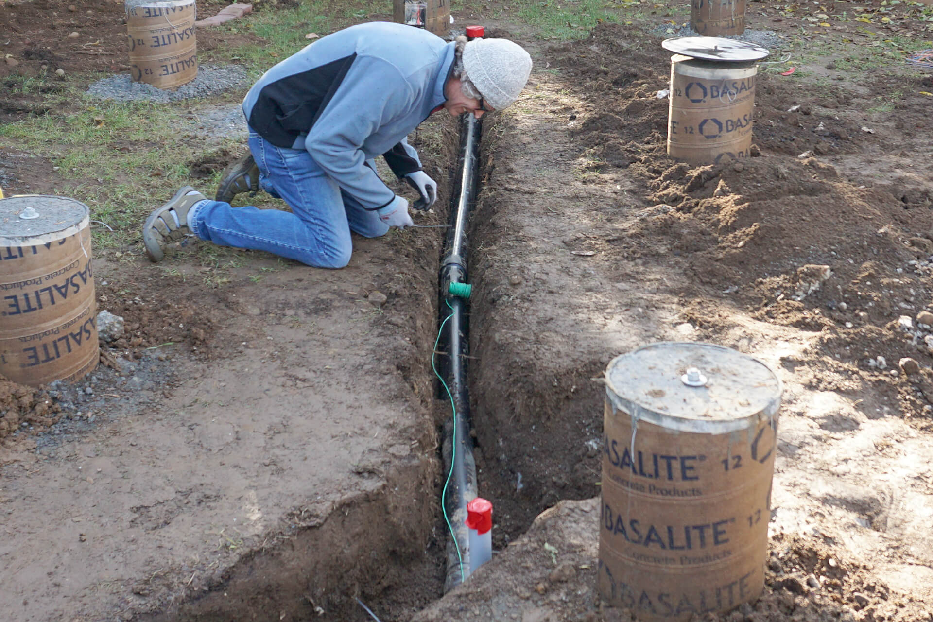 Trenching and laying pipe for utilities.